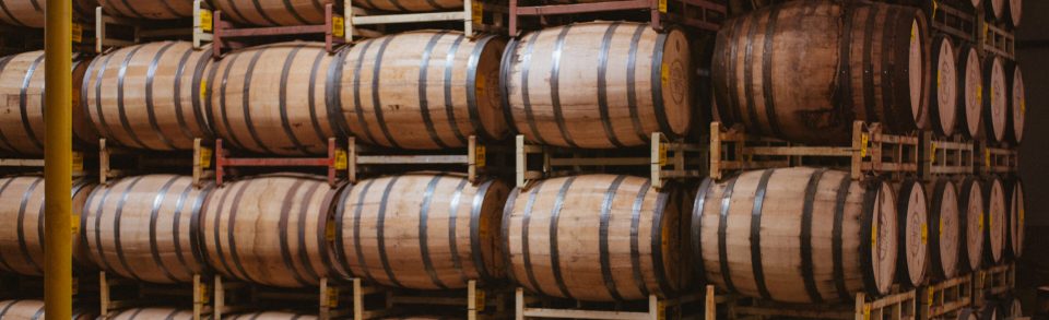 Whiskey barrels in aging room