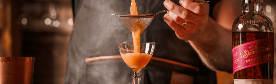 making a whiskey cocktail